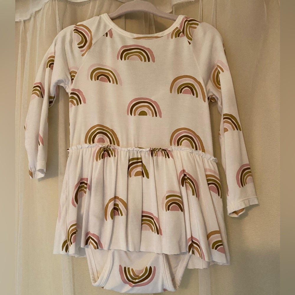 Long sleeved rainbow onesie with skirt attached